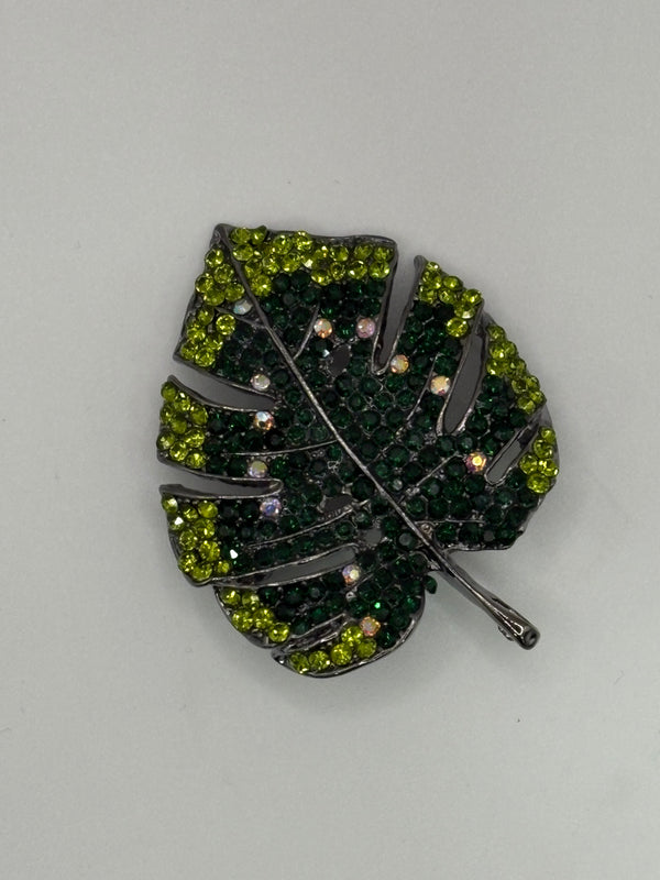Pave Crystal Monstera Leaf Brooch | Gunmetal Tropical Palm Pin (3 Colors) – green; black; red metal fashion jewelry, main product image, Petit Détail