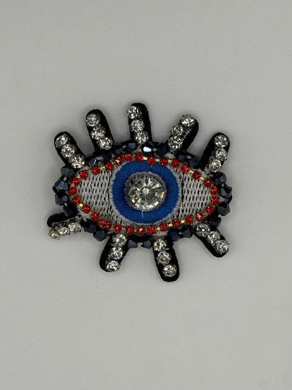 Hand-Embroidered Crystal Lash Evil Eye Brooch | Blue & Red Artisan Pin – blue-1 crystal, metal fashion jewelry, main product image, Petit Détail