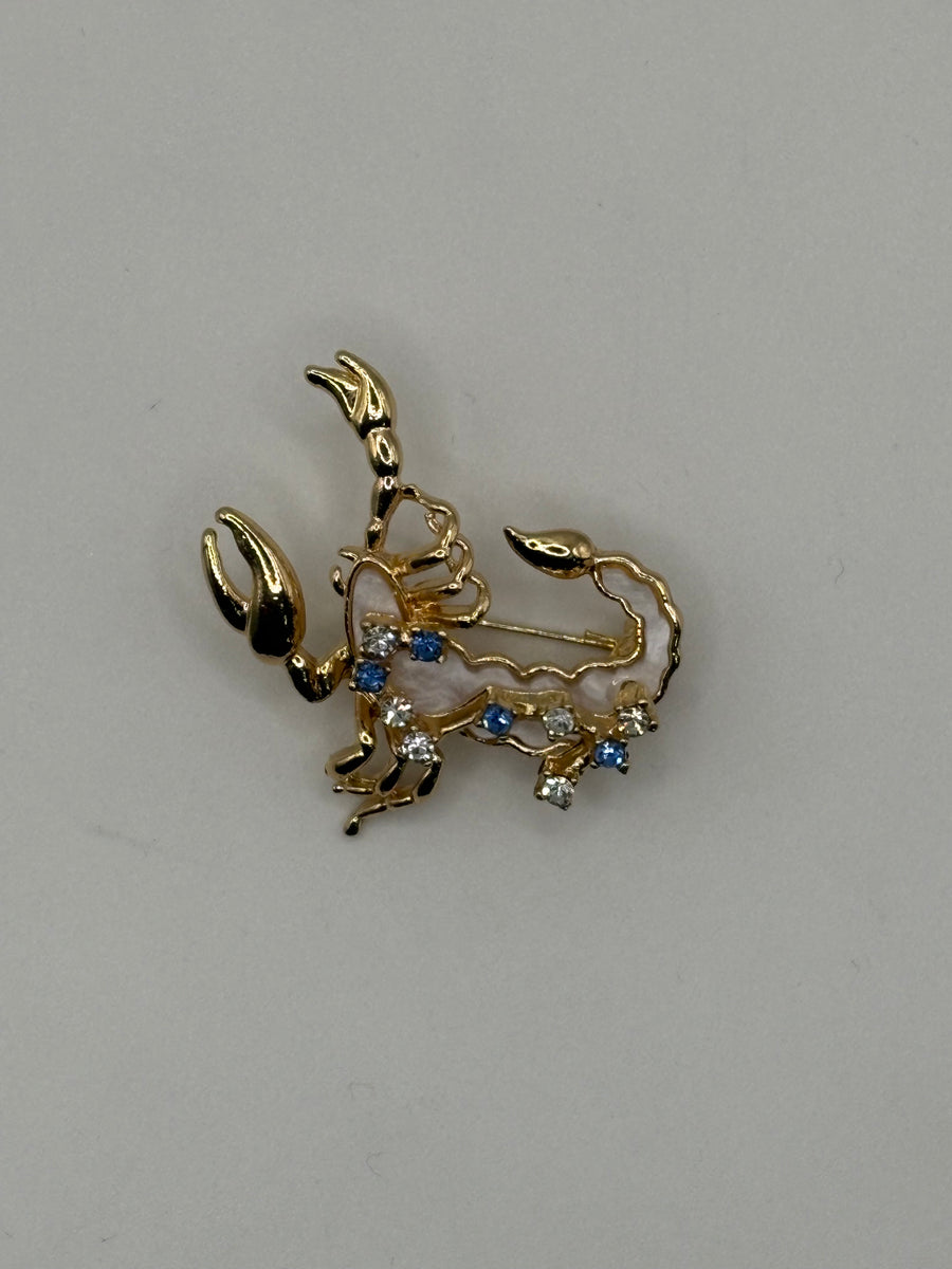 Scorpio Zodiac Brooch | Gold Scorpion Horoscope Pin with Mother of Pearl – animal gold-plated fashion jewelry, main product image, Petit Détail