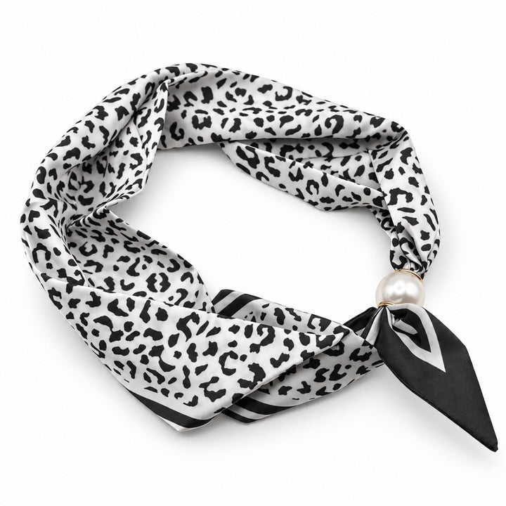 Black and ivory leopard print magnetic scarf with pearl magnetic closure on white background