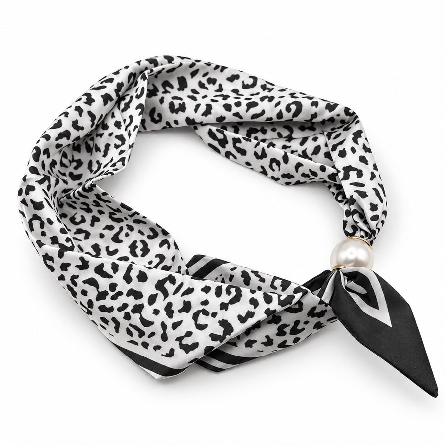 Black and ivory leopard print magnetic scarf with pearl magnetic closure on white background