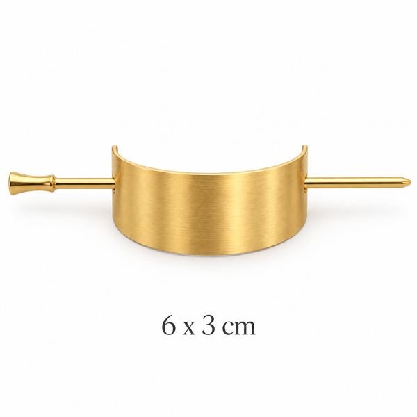 Brushed gold-tone curved hair cuff and matching securing stick on white background, 6 x 3 cm