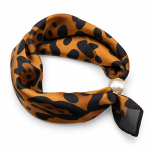 Caramel and black leopard print magnetic scarf with pearl magnetic closure on white background