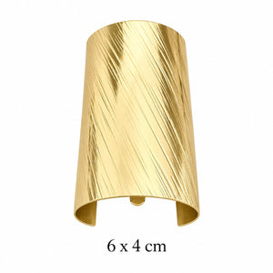 Wide diagonal brushed gold-tone hair cuff with open back on white background, 6 x 4 cm