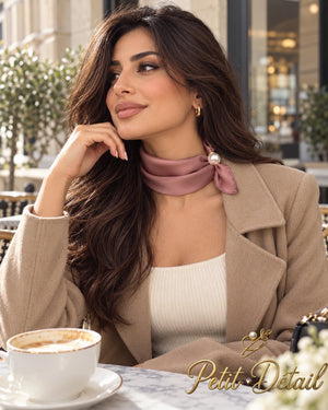 Woman wearing dusty rose magnetic scarf with pearl closure