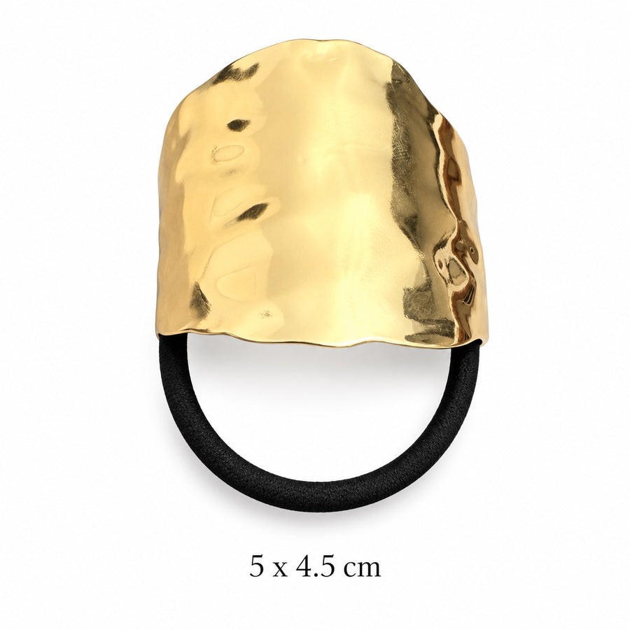 Wide hammered gold-tone hair cuff with black elastic on white background, 5 x 4.5 cm