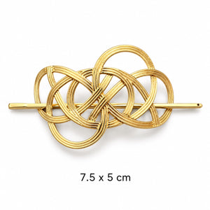 Interwoven gold-tone hair cuff with removable matching stick on white background, 7.5 x 5 cm