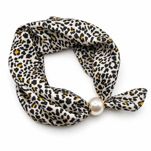 Ivory leopard print magnetic scarf with black spots, mustard accents and pearl magnetic closure