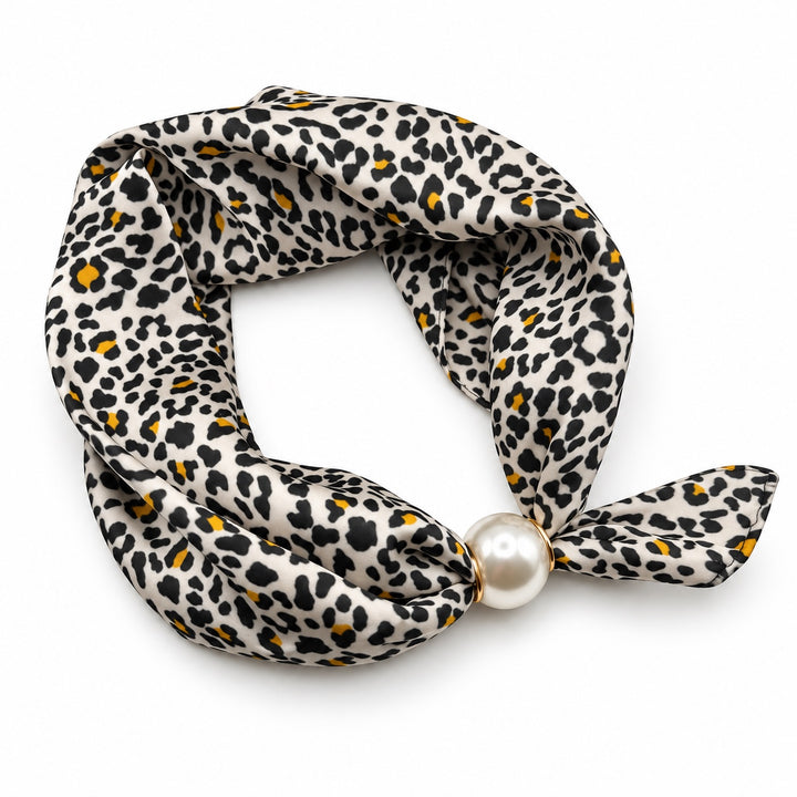 Ivory leopard print magnetic scarf with black spots, mustard accents and pearl magnetic closure