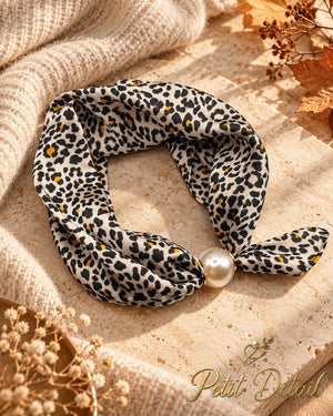 Ivory leopard print magnetic scarf with mustard accents styled with pearl magnetic closure