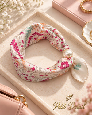 Ivory pink floral magnetic scarf with pearl magnetic closure styled in a soft neutral setting