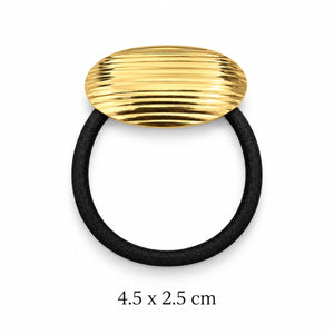 Ribbed oval gold-tone hair cuff with black elastic on white background, 4.5 x 2.5 cm