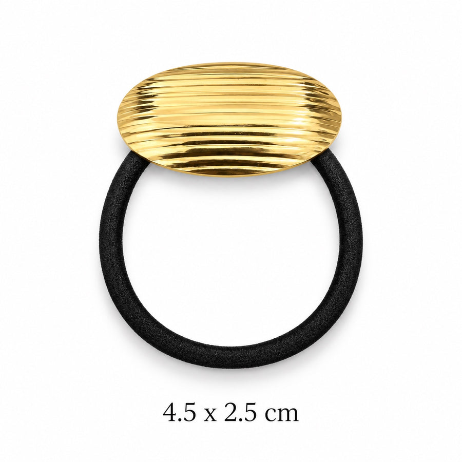 Ribbed oval gold-tone hair cuff with black elastic on white background, 4.5 x 2.5 cm