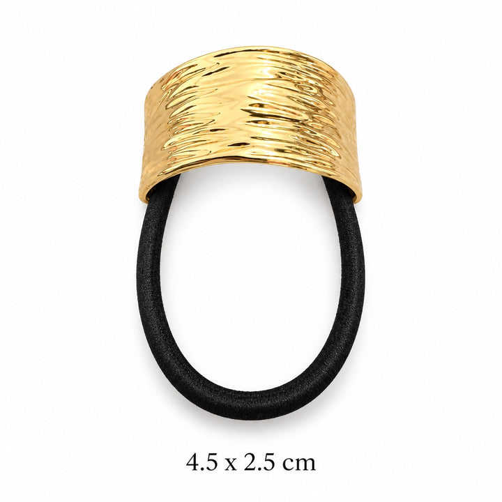 Ripple textured gold-tone hair cuff with black elastic on white background, 4.5 x 2.5 cm
