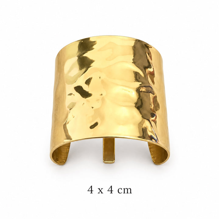 Wide sculpted polished gold-tone hair cuff on white background, 4 x 4 cm