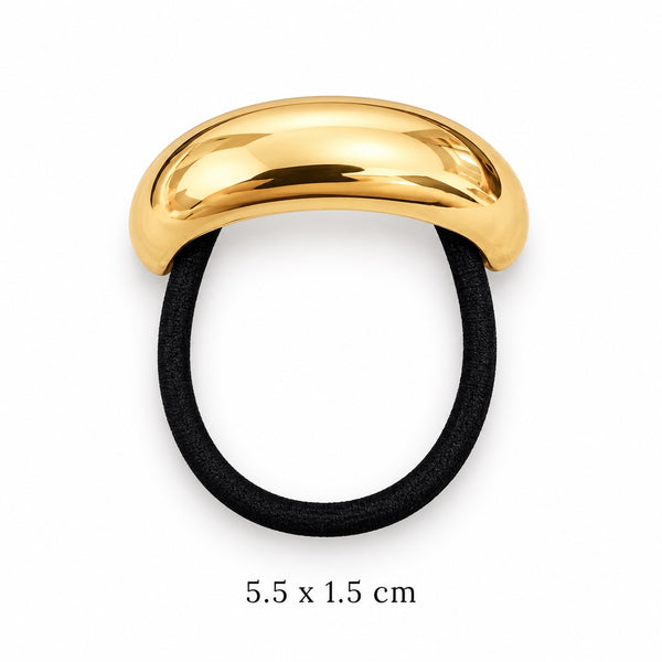 Smooth domed gold-tone hair cuff with attached black elastic on white background, 5.5 x 1.5 cm