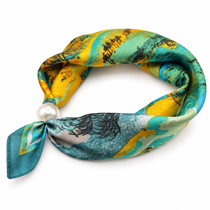 Turquoise and mustard abstract magnetic scarf with pearl magnetic closure on white background