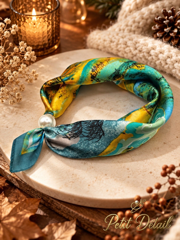 Turquoise and mustard abstract magnetic scarf with pearl magnetic closure on white background
